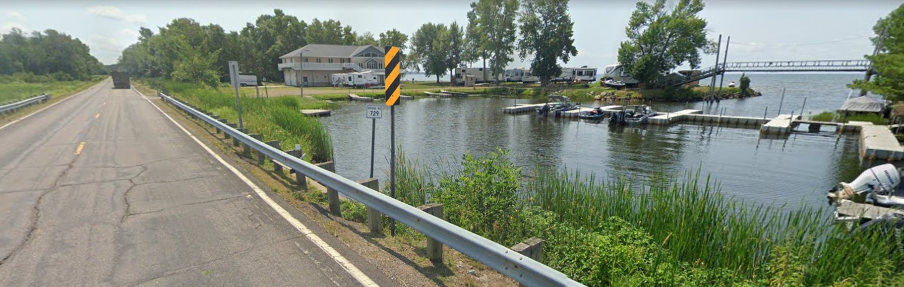 Screen shot of current bridge photo in google shows bay and Hwy 18.